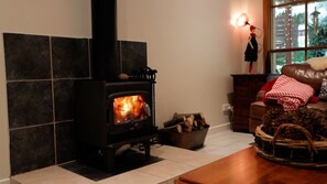 Stay cosy by the fireplace