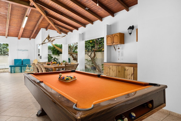 Challenge friends to a game of pool in the breezy outdoor space!