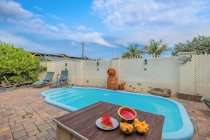 Poolside perfection!  Lounge with a refreshing drink or take a dip in the pool!