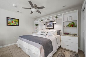 The cottage has king bed and an open floor plan with no obstacles. There is more than 36" space to  bed.