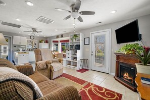 The front living area has a cozy electric fireplace that heats or you can just set it for the "look".