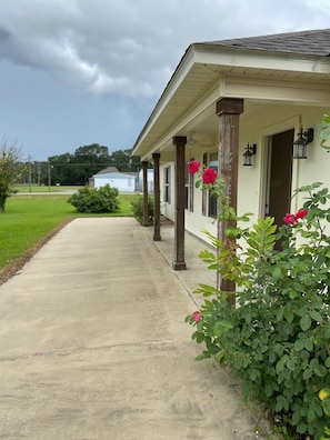 Walkway with porch and sitting area