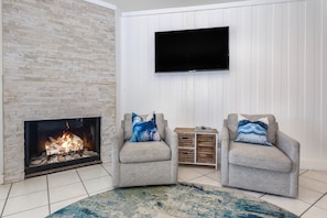 Lounge in style with 2 swivel chairs next to the new remodeled fireplace