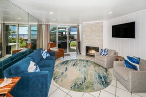 Relax in the living room in either the large comfortable sofa or the two swivel accent chairs.