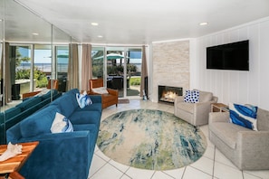 Relax in the living room in either the large comfortable sofa or the two swivel accent chairs.