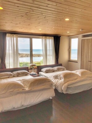 The bright and clean second floor bedroom has two double beds.