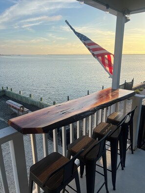 Enjoy sunset cocktails with a bay view on the upstairs deck