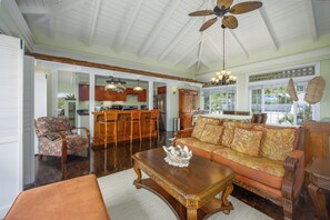 This cozy living room bursts with tropical charm.
