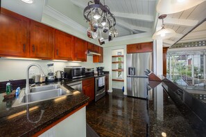 The kitchen is set to prepare a tropical meal amid an island-inspired ambiance.