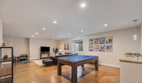 Level up your fun in our game room, complete with a mini bar!