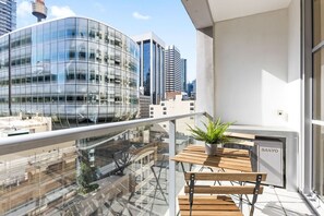 A balcony with city views & a setting.