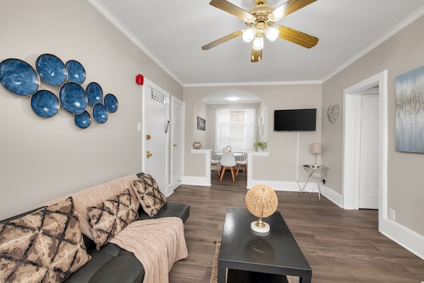 Spacious 2-bedroom apartment with sofa bed, balcony, stocked amenities, and abundant natural light.