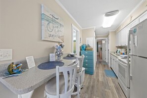 Kitchen with all major appliances and 2-seat breakfast bar