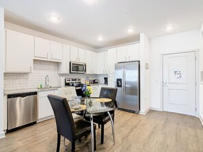 Modern and sleek kitchen, perfect for culinary adventures, during your stay.