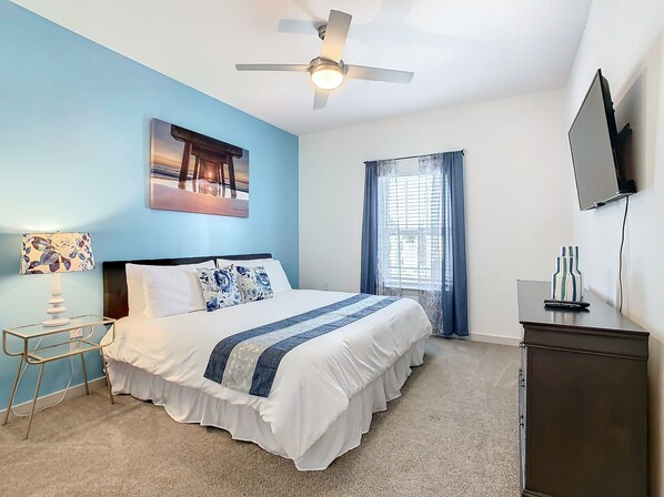 Unwind in Style: Retreat to our expansive bedroom featuring a king-size bed.