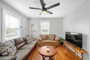 Living Room - Welcome to our cozy living room where you can relax and unwind.