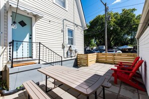 Patio - Picnic-perfect vibes await in this charming yard. Gather 'round the table for memories under the open sky!