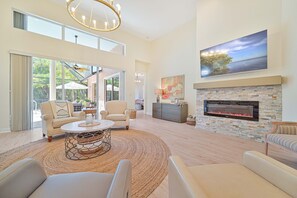 Bonita Bliss - An electric fireplace in the living and TV with cable service. Sliding door open up to the lanai and pool area