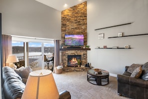 Cozy up in this spacious living room and a fireplace for chilly nights!