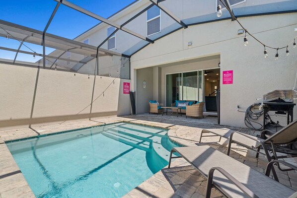 Refreshing Private Pool of the Townhouse in Kissimmee Florida - Immerse yourself in the cool elegance of pool - Lounge Chairs for relaxation - Plush seating for outdoor moments