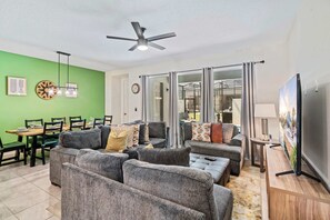 Magnificent Living Area of the Townhouse in Kissimmee Florida - Plush seating arrangements invite relaxation and gatherings - Smart TV and Netflix - Open-concept living area seamlessly connected to a stylish dining space