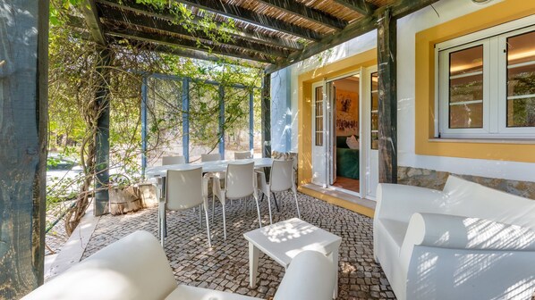 Enjoy an al fresco meal or just the peace and fresh air on this patio with a seating and dining area #patio #outside #algarve #portugal