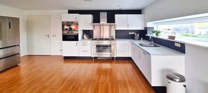 Cook, dine, and entertain in this sleek, modern kitchen.