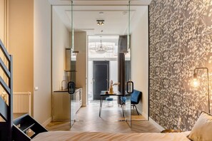 A modern and stylish living space with a mix of natural elements and contemporary design, showcasing a comfortable and inviting atmosphere.