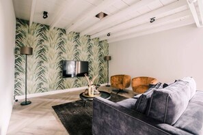 Spacious and inviting, this open-concept living room is designed for comfort and style!