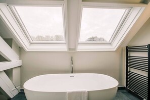 Soak in serenity – this luxurious bathtub invites you to unwind in style.
