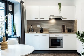 A fully-equipped kitchen with modern appliances, ready for all your cooking needs. Enjoy the spacious and functional layout.