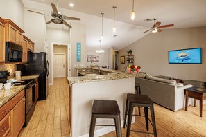 Open Kitchen - - Kitchen seamlessly flows into the living area, offering a perfect space for cooking & socializing
- Modern appliances and a spacious layout make this area ideal for meal prep & entertainment
- Natural light keep the area airy and comfortable