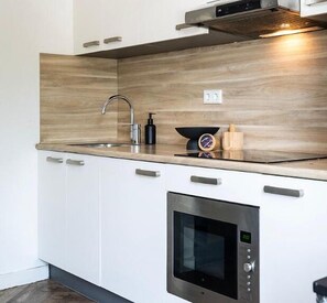 Step through communal hallways to discover our SHARED/COMMUNAL KITCHEN, your space for shared meals and memories.