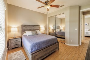 Ultimate Comfort - - Snuggle up in a comfortable bed that promises ultimate comfort and rest
- The rustic wood furniture and soothing tones create a perfectly cozy vibe
- A mirrored closet adds convenience while enhancing the room’s airy feel