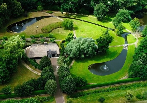 Take in the stunning aerial view of the property, showcasing its spacious layout and beautiful surroundings.