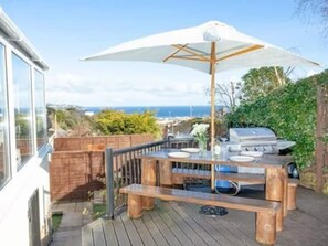 Outdoor BBQ area with sea views