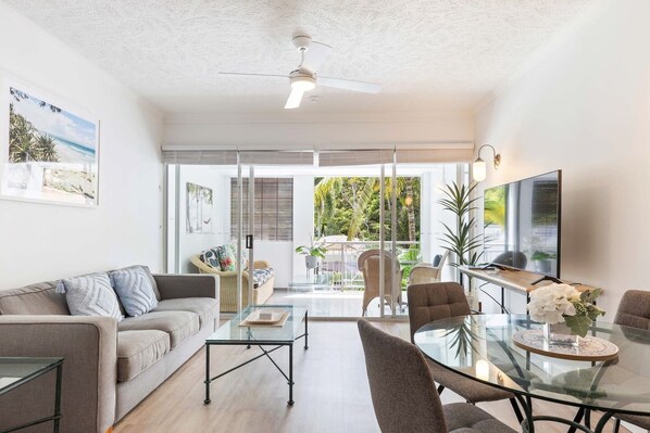 The living area has a cosy lounge sitting adjacent to the balcony entrance, so you can enjoy the comfort of fresh air and sunshine while you recline. 
