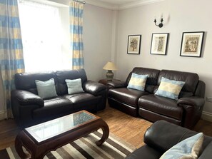 Lounge with two leather sofas and a coffee table