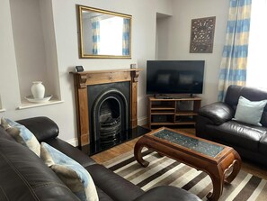 Lounge with gas fire and TV