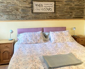 Bedroom with double bed, bedside tables and lamps