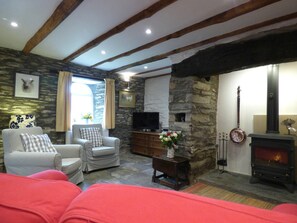 Living room with fireplace, woodburner, sofa, armchairs