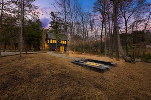 Feel the warmth of our built-in firepit, perfect for cozy evenings under the stars.