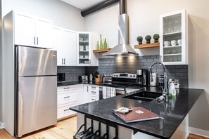 Gourmet Haven: Our kitchen is a dream for culinary enthusiasts, fully equipped for your dining adventures. Just steps from the Stratford Festival and the heart of Stratford, Ontario, whip up delicacies in style."