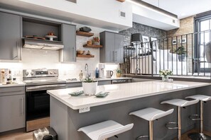 Gourmet Haven: Our kitchen is a dream for culinary enthusiasts, fully equipped for your dining adventures. Just steps from the Stratford Festival and the heart of Stratford, Ontario, whip up delicacies in style."
