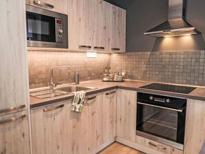 Countertop, Cabinetry, Property, Kitchen, Kitchen Stove, Sink, Kitchen Appliance, Wood, Home Appliance, Kitchen Sink