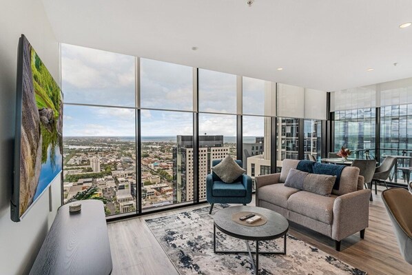 Open-plan living and dining space with amazing views across Melbourne.
