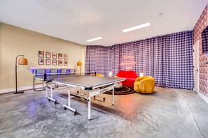 Grab your crew for fun in this stylish game room featuring a ping pong table and comfy seating—ideal for your Nashville getaway or bachelorette party! Unwind and make lasting memories in this chic escape!