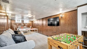 Now this is the perfect man cave—comfy chair, big screen, cold drinks, and zero stress. A space to unwind, vibe out, and just be. Whether it's games, movies, or silence, it’s all yours.