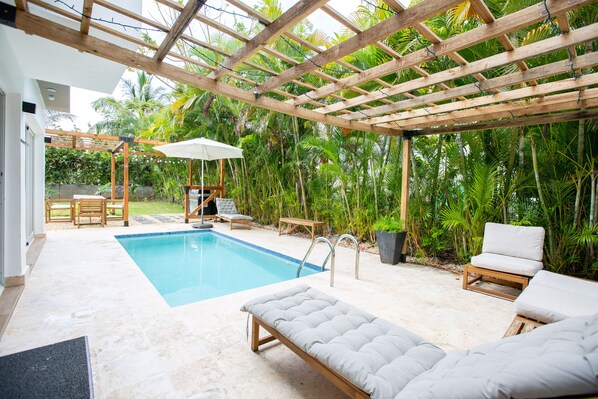 Step into paradise on our terrace boasting a refreshing pool, BBQ area, and expansive garden.