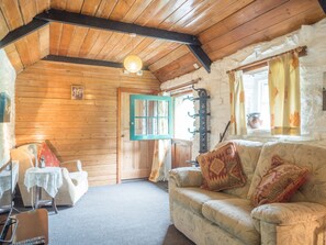 Living area with sofa, armchair, stable door